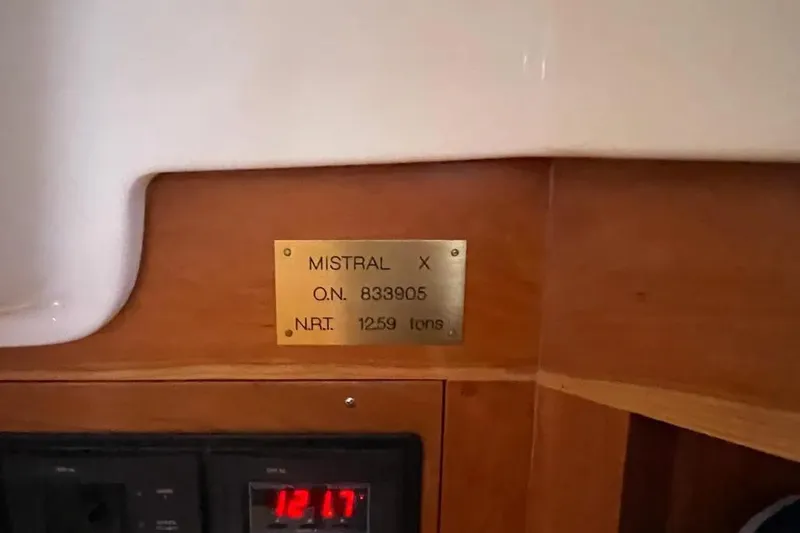 Mistral X Yacht Photos Pics Plaque on Tartan 4300 yacht, 2009 model, displaying registration details and net tonnage.