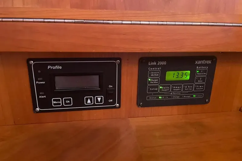 Mistral X Yacht Photos Pics Control panels on a 2009 Tartan 4300, featuring Xantrex Link 2000 battery monitor.