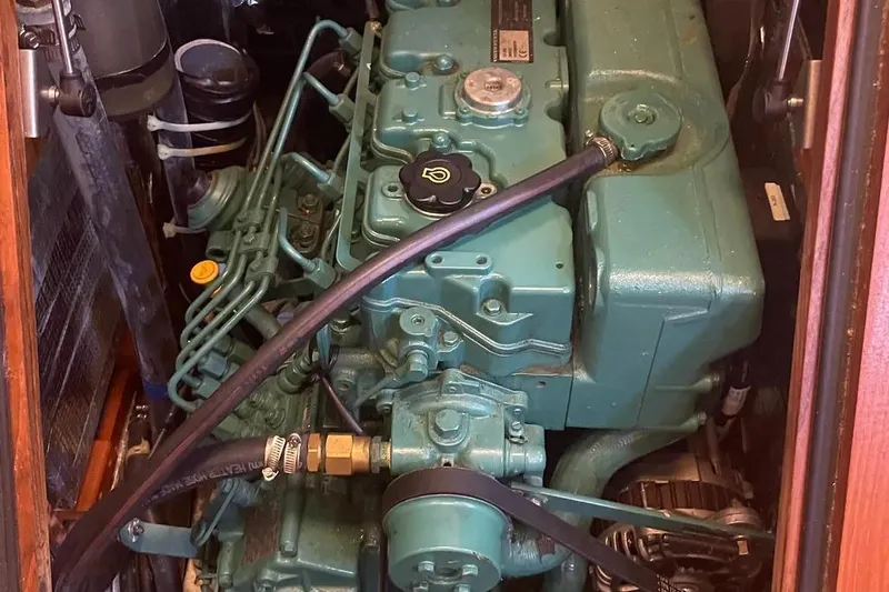 Mistral X Yacht Photos Pics Engine compartment of a 2009 Tartan 4300 sailboat, showcasing detailed mechanical components.