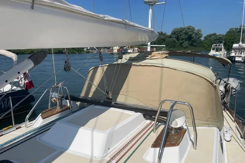 Mistral X Yacht Photos Pics Sailboat Tartan 4300, 2009 model, docked on a sunny day with clear skies.