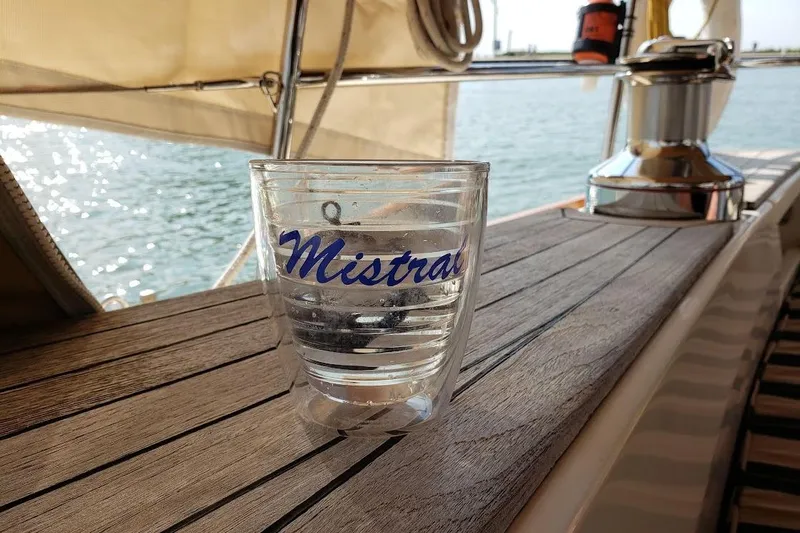 Mistral X Yacht Photos Pics Glass with "Mistral" on Tartan 4300 yacht deck, 2009 model, sunny day.