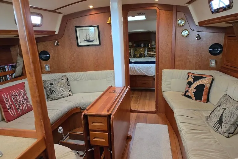 Mistral X Yacht Photos Pics Luxurious 2009 Tartan 4300 yacht interior with cozy seating and elegant wood finishes.
