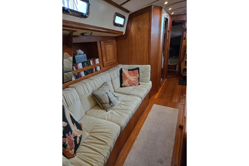 Mistral X Yacht Photos Pics Luxurious 2009 Tartan 4300 yacht interior with plush seating and wooden accents.