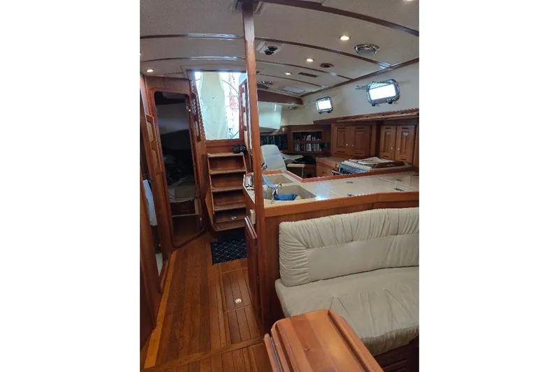 Mistral X Yacht Photos Pics Luxurious 2009 Tartan 4300 yacht interior with elegant wood finish and comfortable seating.