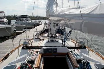 Mistral X Yacht Photos Pics Sailboat Tartan 4300, 2009 model, docked at marina with other boats.