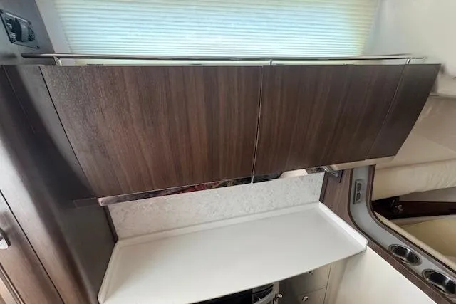  Yacht Photos Pics 2024 Grady-White Canyon 456 interior with sleek wooden cabinetry and modern design.