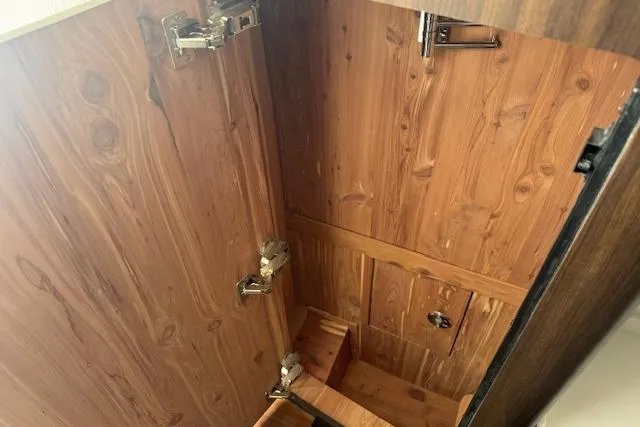  Yacht Photos Pics Wooden cabinet interior with metal hinges in 2024 Grady-White Canyon 456 boat.