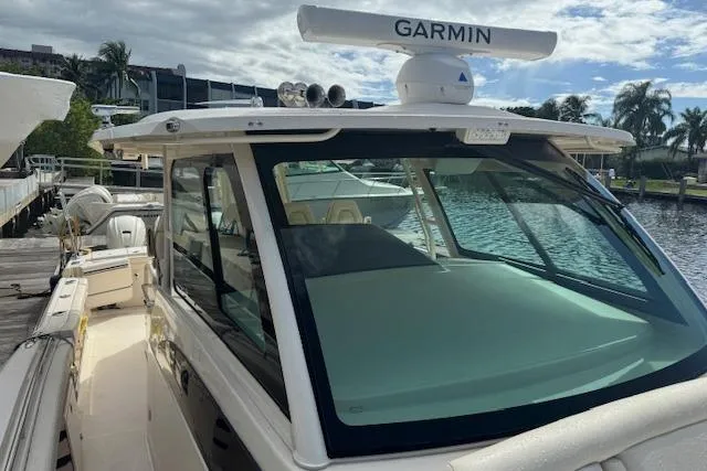  Yacht Photos Pics 2024 Grady-White Canyon 456 boat with Garmin radar, docked by the water.
