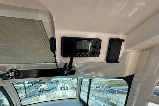  Yacht Photos Pics 2024 Grady-White Canyon 456 boat interior with Garmin radio and speaker system.