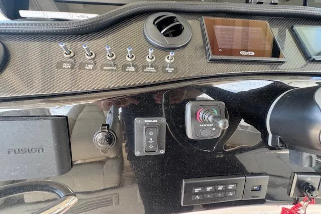  Yacht Photos Pics 2024 Grady-White Canyon 456 dashboard with controls and display screen.