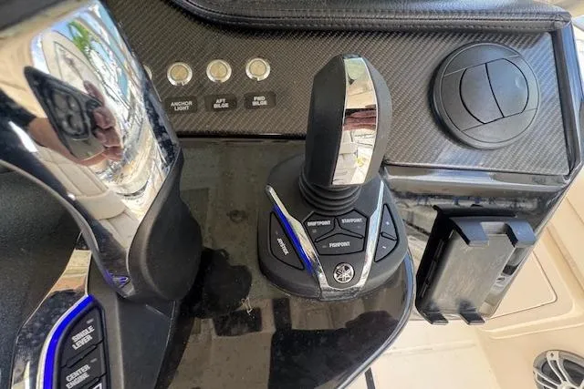  Yacht Photos Pics 2024 Grady-White Canyon 456 boat control panel with joystick and buttons.