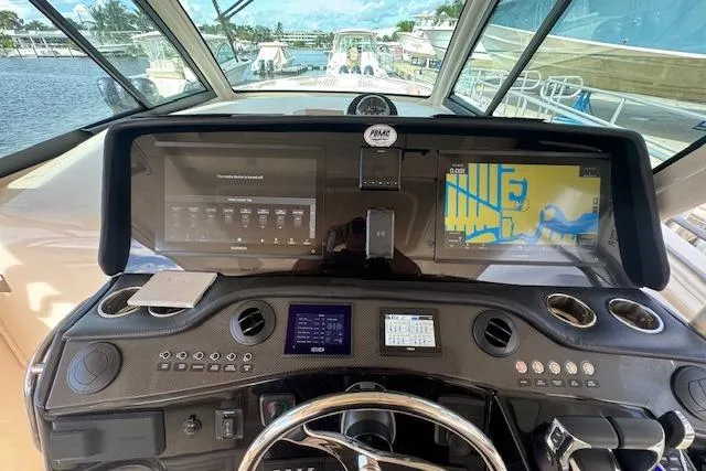  Yacht Photos Pics 2024 Grady-White Canyon 456 helm with advanced navigation and control systems.