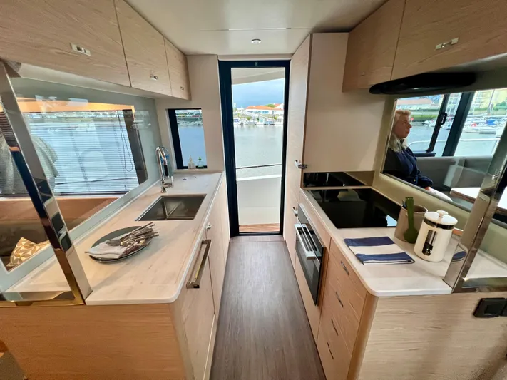 Yacht Photos Pics Modern kitchen interior of 2025 Beneteau Swift Trawler 54 yacht.