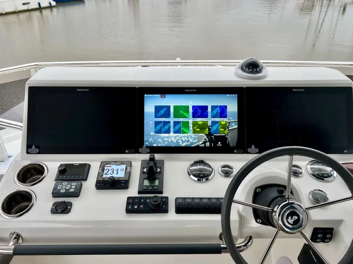  Yacht Photos Pics Helm station of 2025 Beneteau Swift Trawler 54 with advanced navigation systems.