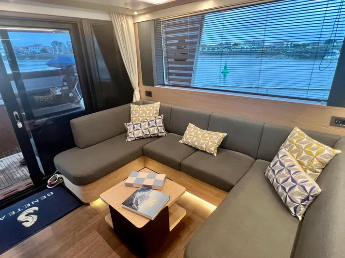  Yacht Photos Pics Interior of 2025 Beneteau Swift Trawler 54 with cozy seating and waterfront view.