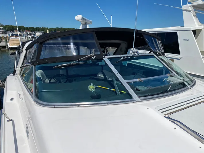  Yacht Photos Pics 1993 Sea Ray 500 Sundancer docked at a marina on a sunny day.