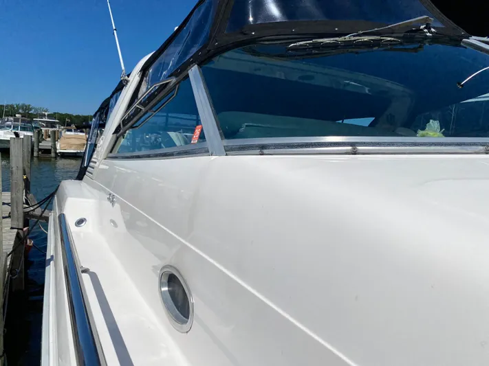  Yacht Photos Pics 1993 Sea Ray 500 Sundancer yacht docked at a marina on a sunny day.