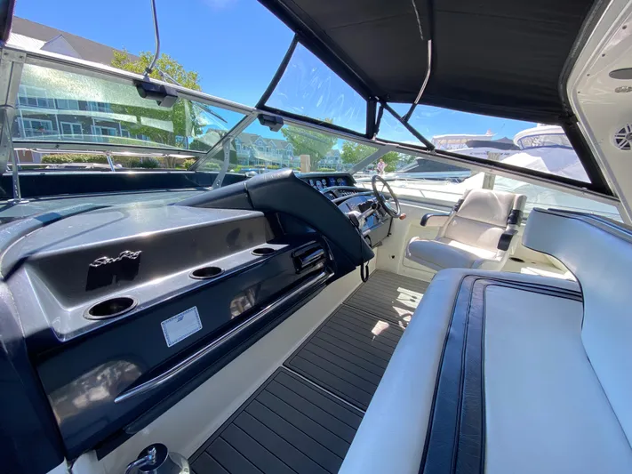  Yacht Photos Pics Interior cockpit of a 1993 Sea Ray 500 Sundancer yacht with modern seating and controls.