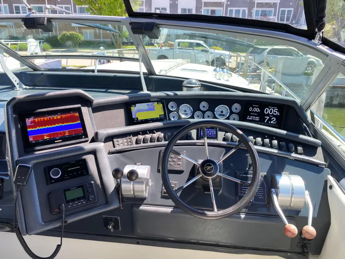  Yacht Photos Pics 1993 Sea Ray 500 Sundancer helm with modern navigation and control systems.