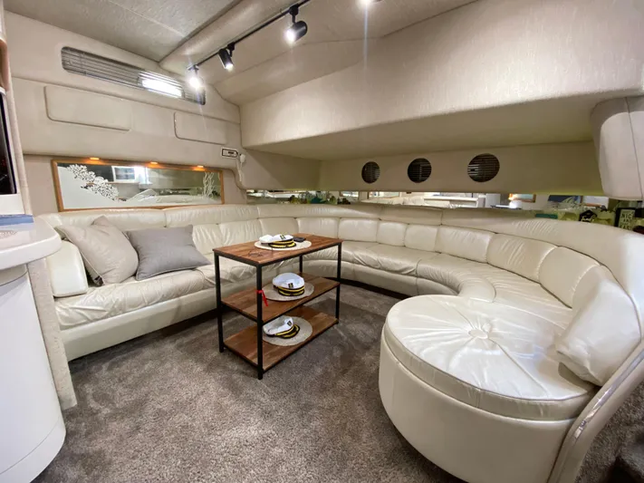  Yacht Photos Pics Luxurious interior of 1993 Sea Ray 500 Sundancer with plush seating and modern decor.