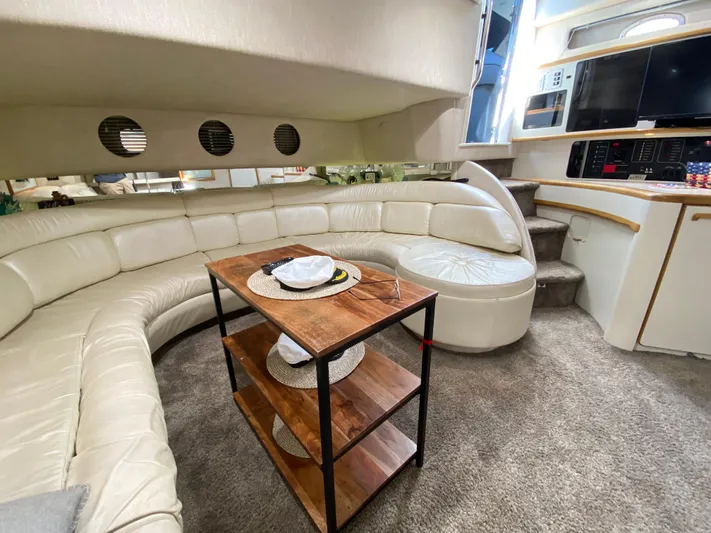  Yacht Photos Pics Luxurious interior of a 1993 Sea Ray 500 Sundancer yacht with plush seating and modern amenities.