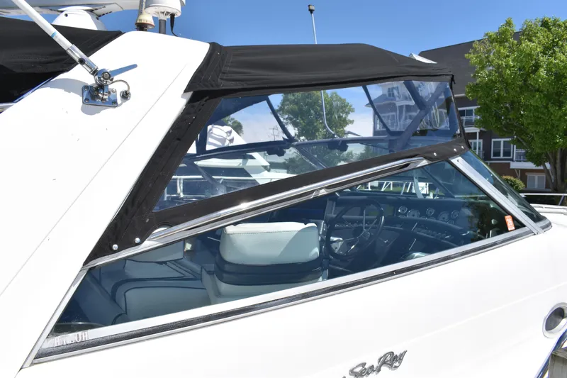  Yacht Photos Pics 1993 Sea Ray 500 Sundancer boat with black canopy and white interior.