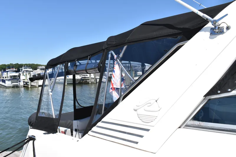  Yacht Photos Pics 1993 Sea Ray 500 Sundancer docked at marina with black canopy.