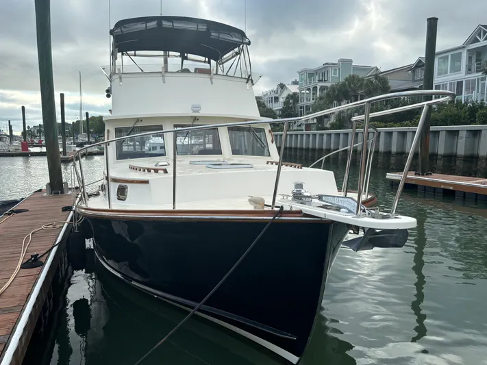 Gullywhumper Yacht Photos Pics Ellis 36 Flybridge 2001 yacht docked at marina, featuring sleek design and spacious flybridge.