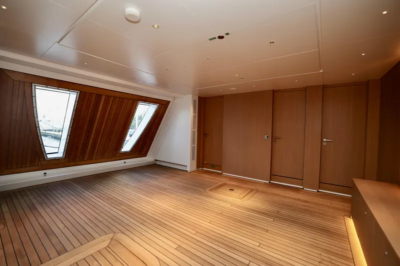  Yacht Photos Pics Luxurious interior of 2024 Rossinavi 49M Sport Yacht with wooden flooring and modern design.