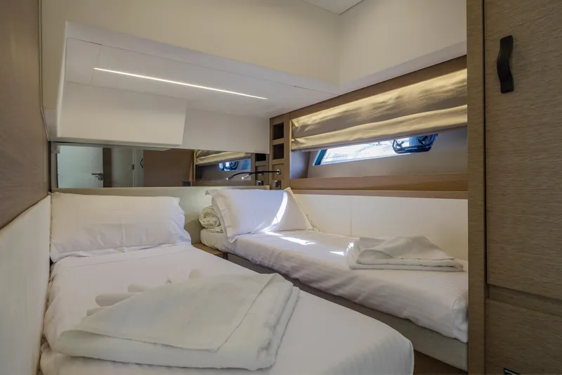  Yacht Photos Pics Luxurious twin cabin interior of 2022 Prestige 520 yacht with modern design.
