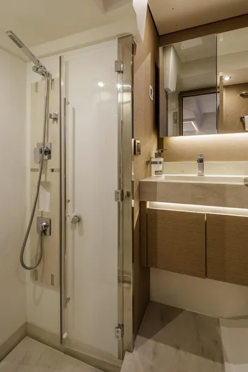  Yacht Photos Pics Luxurious bathroom in 2022 Prestige 520 yacht with modern shower and vanity.