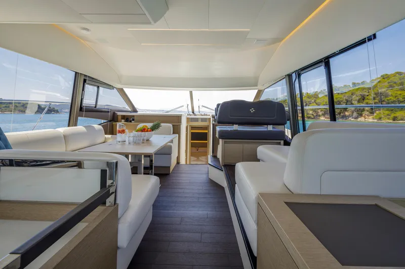  Yacht Photos Pics Luxurious interior of 2022 Prestige 520 yacht with modern seating and scenic views.