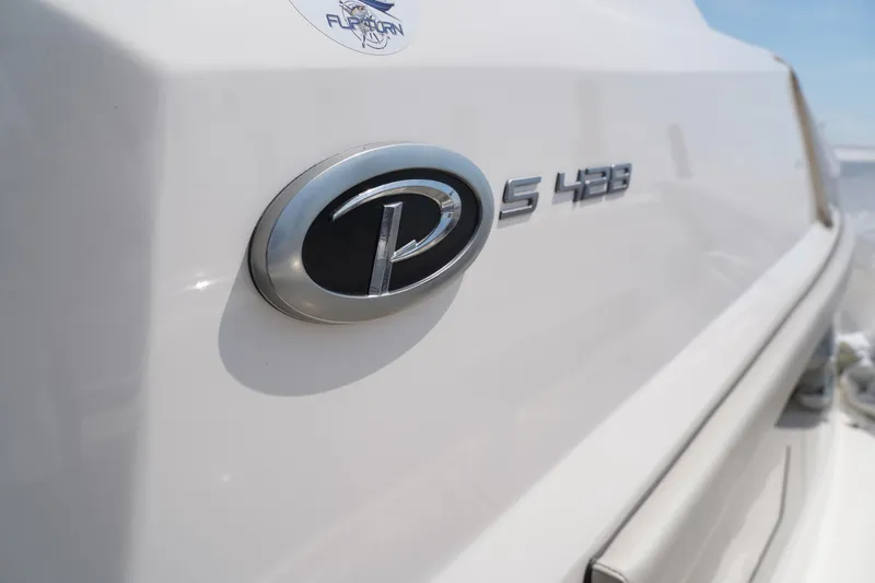  Yacht Photos Pics 2022 Pursuit 428 boat emblem and model detail.
