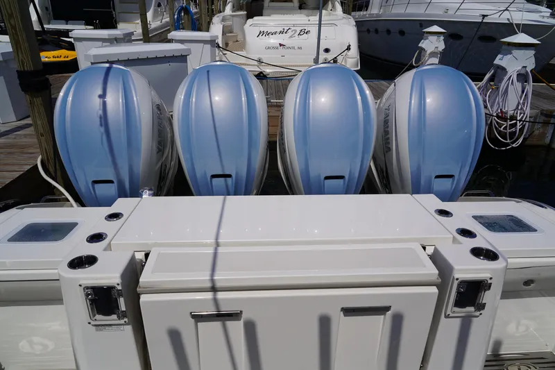  Yacht Photos Pics Four Yamaha outboard motors on a 2022 Pursuit 428 boat at a marina.
