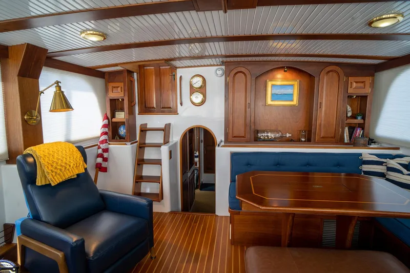 Irish Ayes Yacht Photos Pics Luxurious interior of 1993 Atlantic Duffy 48 yacht with wooden decor and plush seating.