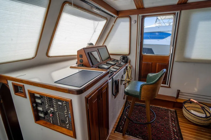 Irish Ayes Yacht Photos Pics Interior helm of 1993 Atlantic Duffy 48 boat with control panel and chair.
