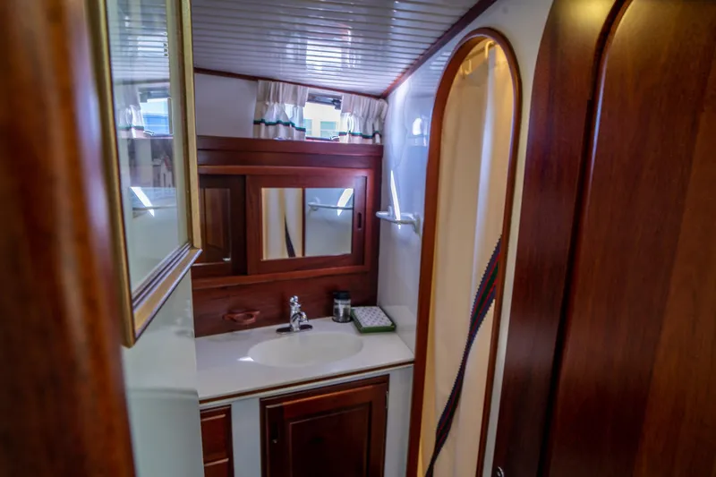 Irish Ayes Yacht Photos Pics Luxurious wooden bathroom interior of 1993 Atlantic Duffy 48 yacht.