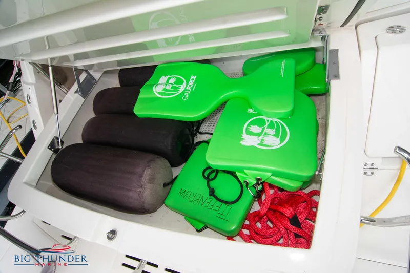  Yacht Photos Pics Storage compartment on 2012 Sea Ray 410 Sundancer with green and black boating accessories.