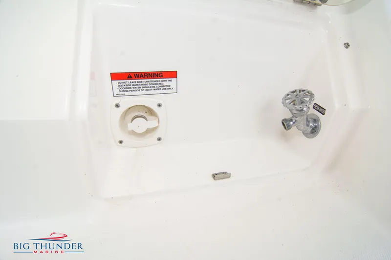  Yacht Photos Pics Sea Ray 410 Sundancer 2012 boat detail with warning label and valve.