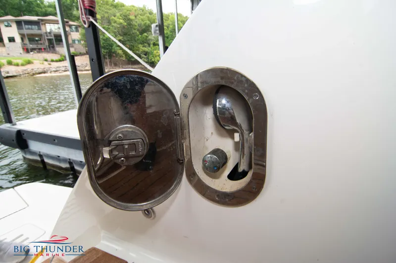  Yacht Photos Pics Sea Ray 410 Sundancer 2012 boat fuel cap with open cover, dockside view.
