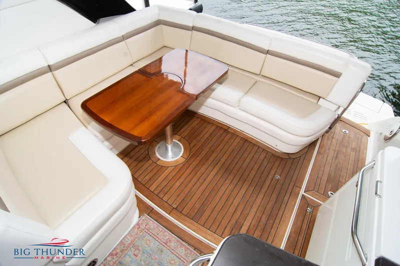  Yacht Photos Pics Luxurious seating area on 2012 Sea Ray 410 Sundancer yacht with wooden table.
