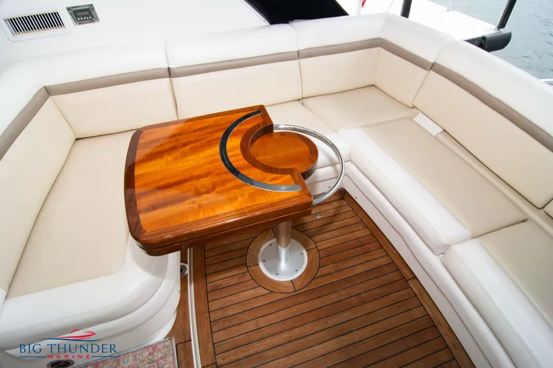  Yacht Photos Pics Luxurious seating area on 2012 Sea Ray 410 Sundancer yacht with wooden table.