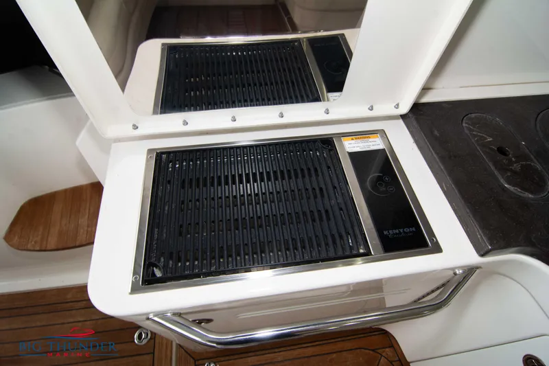  Yacht Photos Pics Outdoor grill on 2012 Sea Ray 410 Sundancer yacht with sleek design and wooden flooring.