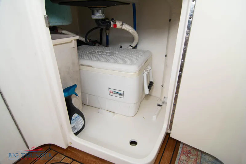  Yacht Photos Pics Storage compartment on 2012 Sea Ray 410 Sundancer boat with cooler and cleaning supplies.