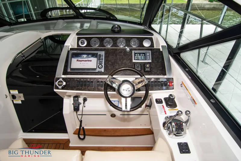  Yacht Photos Pics 2012 Sea Ray 410 Sundancer helm with advanced navigation controls and steering wheel.