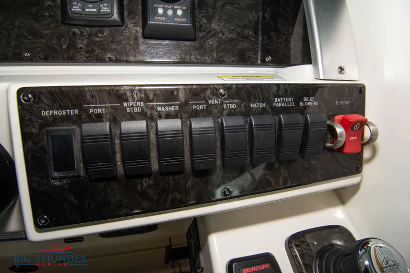  Yacht Photos Pics Control panel of a 2012 Sea Ray 410 Sundancer boat with various switches.