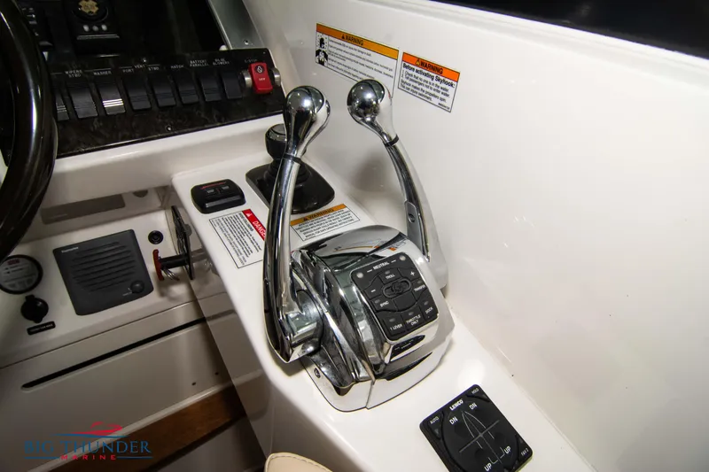  Yacht Photos Pics Close-up of 2012 Sea Ray 410 Sundancer boat controls and throttle levers.