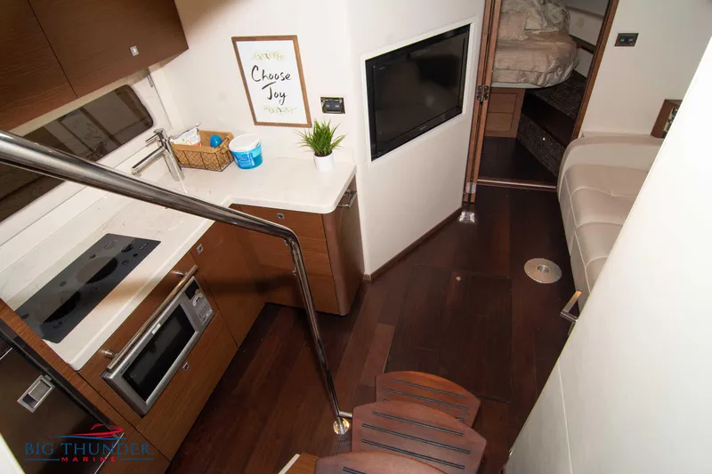  Yacht Photos Pics Interior of 2012 Sea Ray 410 Sundancer yacht with modern kitchen and cozy seating area.