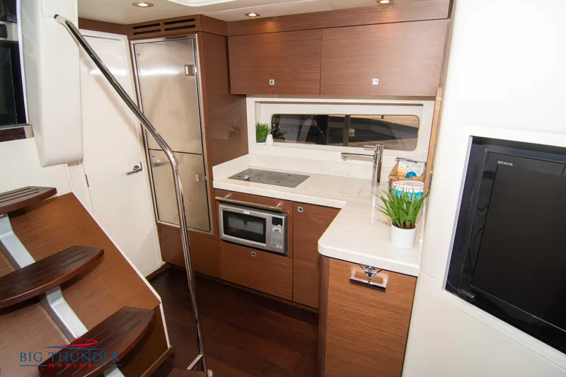  Yacht Photos Pics 2012 Sea Ray 410 Sundancer yacht interior with modern kitchen and sleek design.
