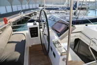 Cockpit of 2020 Lagoon 620 yacht with steering wheel and navigation controls.